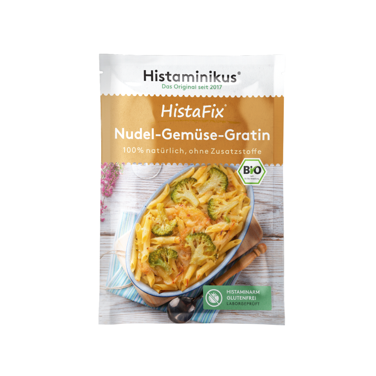 HistaFix-Beutel „Nudel-Gemüse-Gratin“ von Histaminikus mit einem überbackenen Gratin aus Penne und Brokkoli auf der Vorderseite, braun-weißes Verpackungsdesign mit Bio-Siegel und Hinweis „histaminarm, glutenfrei, laborgeprüft“.