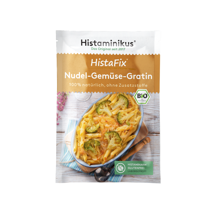 HistaFix-Beutel „Nudel-Gemüse-Gratin“ von Histaminikus mit einem überbackenen Gratin aus Penne und Brokkoli auf der Vorderseite, braun-weißes Verpackungsdesign mit Bio-Siegel und Hinweis „histaminarm, glutenfrei, laborgeprüft“.