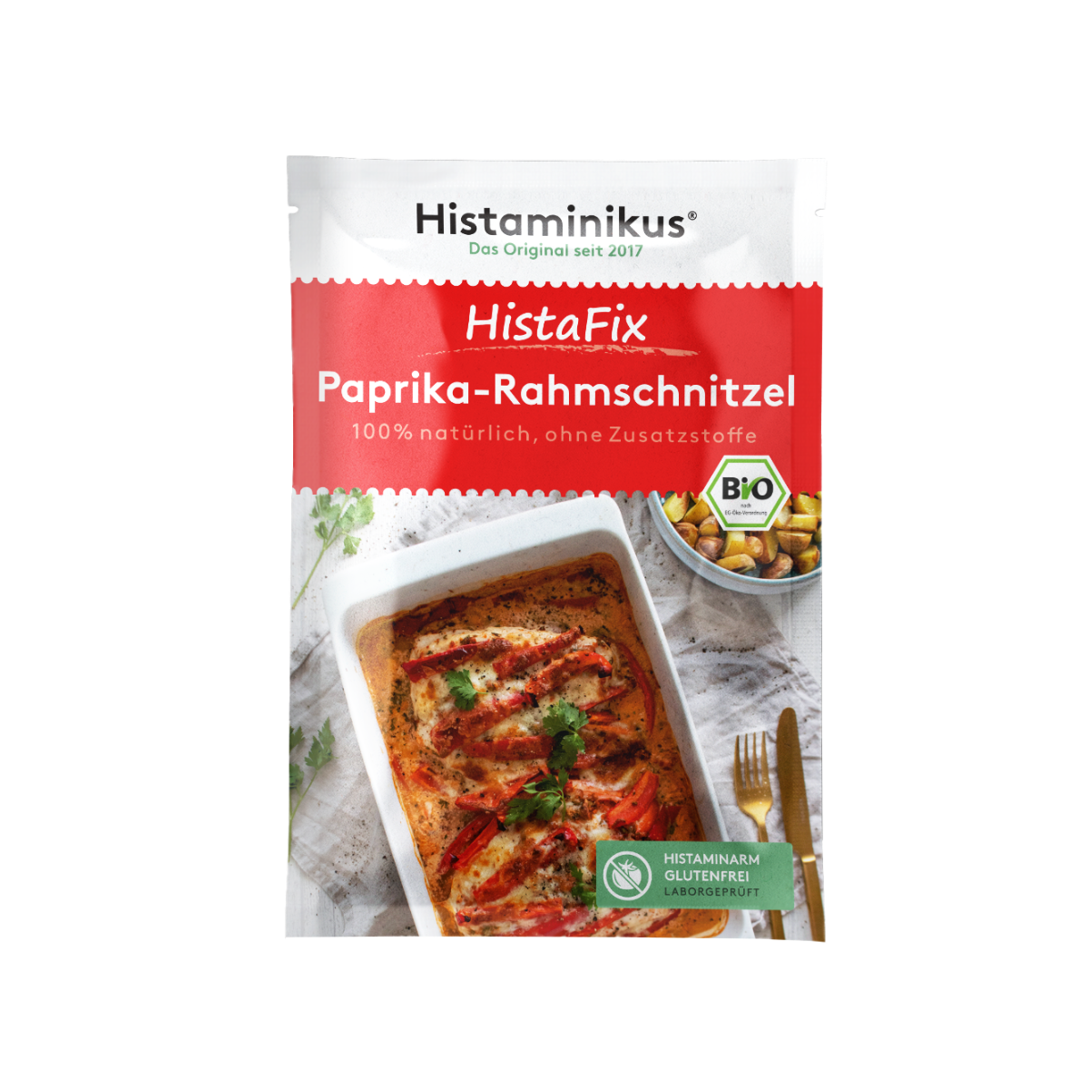 HistaFix-Beutel „Paprika-Rahmschnitzel“ von Histaminikus mit appetitlicher Abbildung eines überbackenen Hähnchengerichts in cremiger Paprikarahmsoße, roter Verpackung mit Bio-Siegel und Hinweis „histaminarm, glutenfrei, laborgeprüft“.