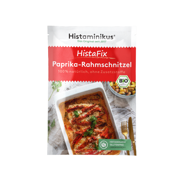 HistaFix-Beutel „Paprika-Rahmschnitzel“ von Histaminikus mit appetitlicher Abbildung eines überbackenen Hähnchengerichts in cremiger Paprikarahmsoße, roter Verpackung mit Bio-Siegel und Hinweis „histaminarm, glutenfrei, laborgeprüft“.