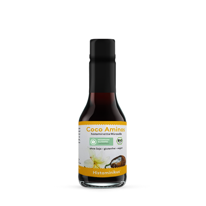 Kleine Glasflasche (145 ml) mit schwarzem Deckel und Etikett „Coco Aminos – histaminarme Würzsoße“. Bio- und histaminarm-Siegel, Aufschrift: ohne Soja, glutenfrei, vegan.