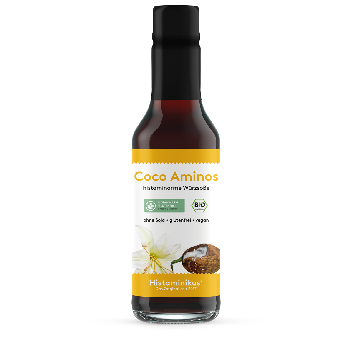 Große Glasflasche (245 ml) mit schwarzem Deckel und Etikett „Coco Aminos – histaminarme Würzsoße“. Abbildung einer Kokosnuss und Blüte, mit Bio- und histaminarm-Siegel. Aufschrift: ohne Soja, glutenfrei, vegan.
