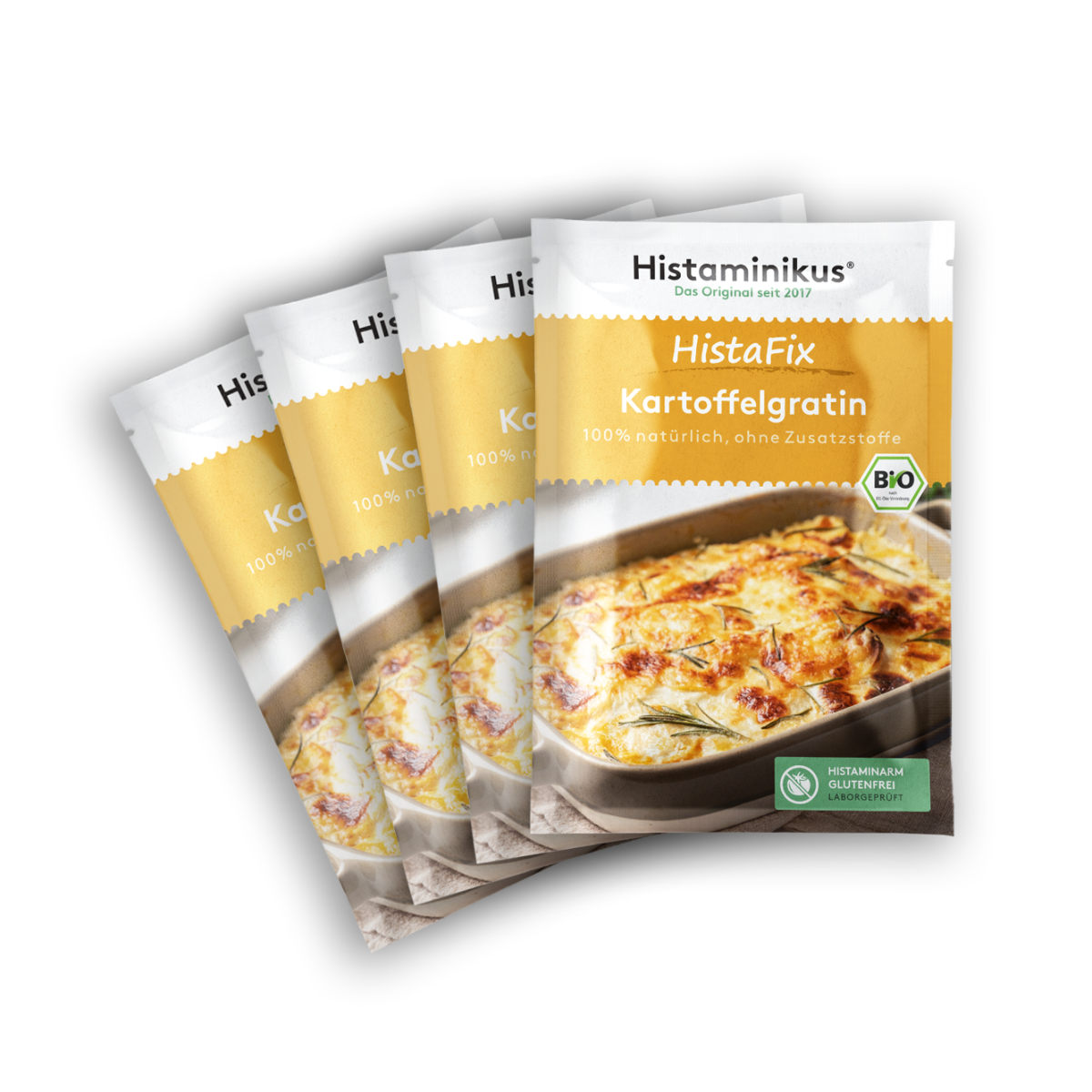 Vier nebeneinander gelegte HistaFix-Beutel „Kartoffelgratin“ von Histaminikus, mit appetitlich überbackenem Gratin auf der Vorderseite, gelb-weißes Verpackungsdesign mit Bio-Siegel und Hinweis „histaminarm, glutenfrei, laborgeprüft“.