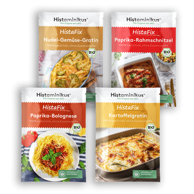 Vier verschiedene HistaFix-Beutel von Histaminikus nebeneinander angeordnet: Nudel-Gemüse-Gratin, Paprika-Rahmschnitzel, Paprika-Bolognese und Kartoffelgratin. Jedes mit appetitlichem Gerichtfoto, Bio-Siegel und grünem Hinweis „histaminarm, glutenfrei, laborgeprüft“.