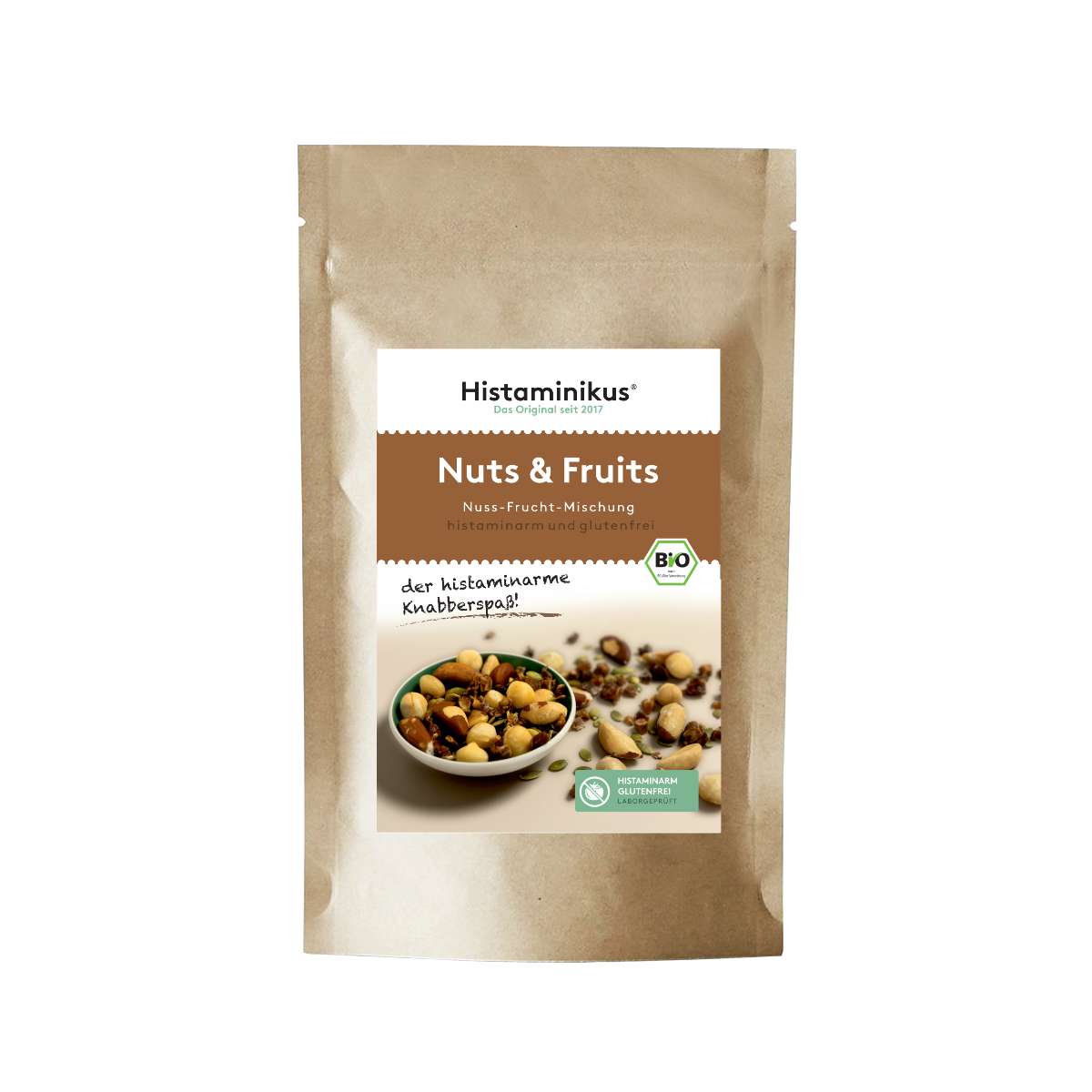 Braune Verpackung mit Etikett „Nuts & Fruits – Nuss-Frucht-Mischung“.
Darunter: „histaminarm und glutenfrei“ sowie „der histaminarme Knabberspaß!“
Abgebildet ist eine Schale mit Nüssen und Trockenfrüchten.
Grünes Siegel: „Histaminarm, glutenfrei, laborgeprüft“.
BIO-Logo oben rechts.