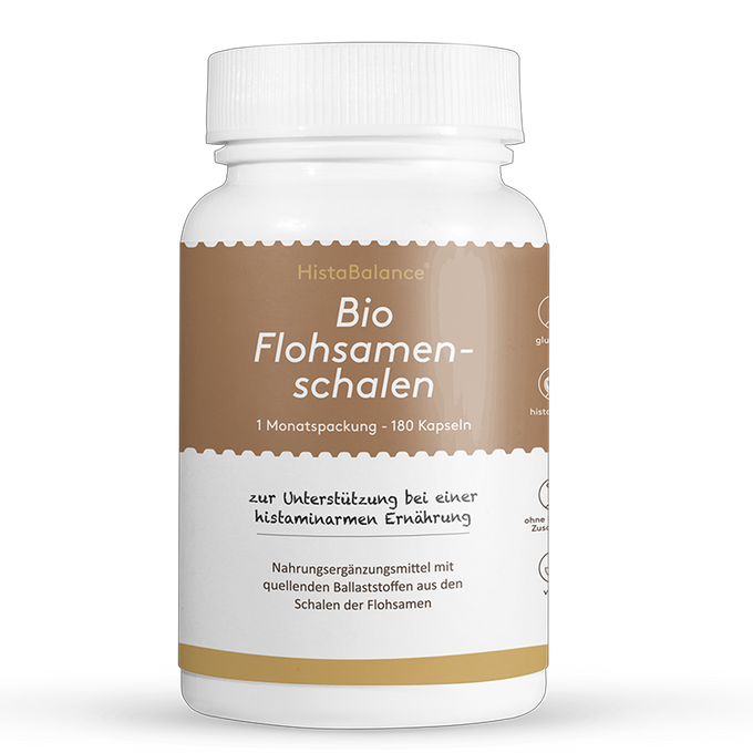 Weiße Kunststoffdose mit braunem Etikett. Aufschrift: „Bio Flohsamenschalen – 1 Monatspackung, 180 Kapseln“. Hinweis auf histaminarme Ernährung und Ballaststoffe.