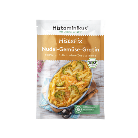 HistaFix-Beutel „Nudel-Gemüse-Gratin“ von Histaminikus mit einem überbackenen Gratin aus Penne und Brokkoli auf der Vorderseite, braun-weißes Verpackungsdesign mit Bio-Siegel und Hinweis „histaminarm, glutenfrei, laborgeprüft“.