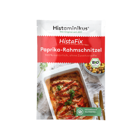 HistaFix-Beutel „Paprika-Rahmschnitzel“ von Histaminikus mit appetitlicher Abbildung eines überbackenen Hähnchengerichts in cremiger Paprikarahmsoße, roter Verpackung mit Bio-Siegel und Hinweis „histaminarm, glutenfrei, laborgeprüft“.