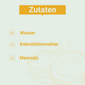 Helle Grafik mit der Überschrift „Zutaten“. Aufgelistet sind:
– Wasser
– Kokosblütennektar
– Meersalz
Links neben jedem Punkt ein stilisiertes Blüten-Icon, im Hintergrund eine gezeichnete Kokosnuss.