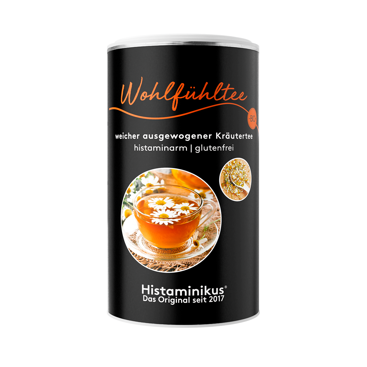 Schwarze Teedose mit der Aufschrift „Wohlfühltee – weicher ausgewogener Kräutertee – histaminarm | glutenfrei“. Auf dem Etikett ein großes rundes Bild mit einer Glastasse gefüllt mit Kräutertee, dekoriert mit Kamillenblüten, daneben ein kleineres Bild mit getrockneten Blüten. Unten das Logo „Histaminikus – Das Original seit 2017“.
