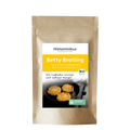 Braune Standbodenverpackung mit Etikett des Produkts „Betty Bratling“. Oben auf dem Etikett der Schriftzug „Histaminikus, Das Original seit 2017“. Darunter gelbes Feld mit Produktname „Betty Bratling“ und Hinweis „vegane Bratlingmischung, histaminarm und glutenfrei“. Im unteren Bereich des Etiketts ein Foto von drei goldbraunen Bratlingen in einer schwarzen Pfanne. BIO-Siegel und Symbol für histaminarm und glutenfrei sichtbar.