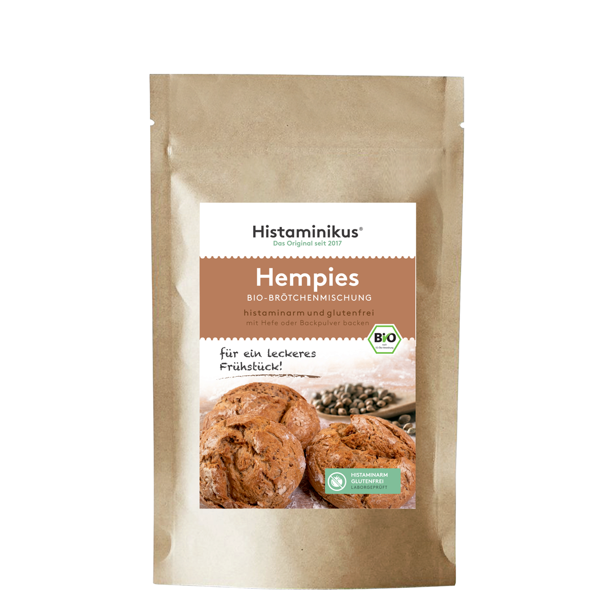 Standbodenverpackung aus braunem Papier mit weißem Etikett. Beschriftet mit „Hempies – Bio-Brötchenmischung“. Darunter Foto von drei Brötchen.
Mit dem Text: „für ein leckeres Frühstück!“ und Bio-Siegel.