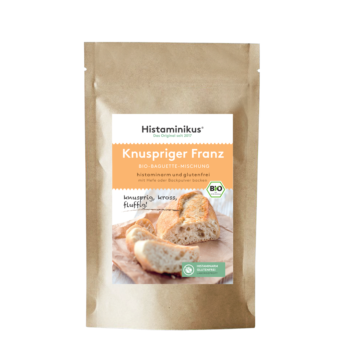 Produktabbildung der braunen Kraftpapierverpackung mit Etikett „Knuspriger Franz – Bio-Baguette-Mischung“. Untertitel: „histaminarm und glutenfrei – mit Hefe oder Backpulver backen“. Im unteren Bereich ein Foto von frisch gebackenem Baguette auf einem Holzbrett, mit dem handschriftlichen Zusatz „knusprig, kross, fluffig!“. Daneben grüne Siegel für „histaminarm glutenfrei“ und Bio-Qualität.