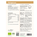 Etikett einer Keksbackmischung mit orangefarbener Überschrift „Keksgenuss“. Links Angaben zu Zutaten und Nährwerten, z. B. mit Reismehl, Erdmandelmehl und Chiasamen. Rechts eine illustrierte Schritt-für-Schritt-Backanleitung: Teig verkneten, kühlen, ausrollen, backen bei 175 °C für 13–18 Minuten. Unten Herstellerangaben, Bio-Siegel, QR-Code und Lagerhinweis.