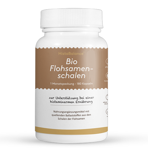 Weiße Kunststoffdose mit braunem Etikett. Aufschrift: „Bio Flohsamenschalen – 1 Monatspackung, 180 Kapseln“. Hinweis auf histaminarme Ernährung und Ballaststoffe.